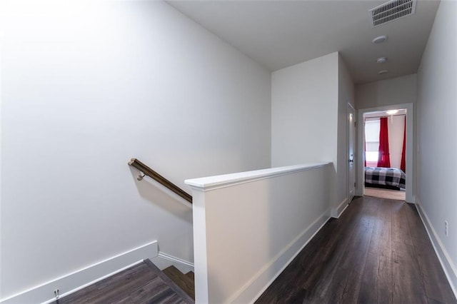 hallway with dark hardwood / wood-style floors