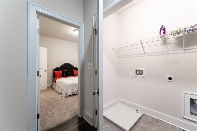 clothes washing area featuring washer hookup, electric dryer hookup, and dark carpet