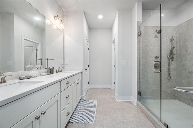 bathroom featuring tile flooring, double vanity, and an enclosed shower