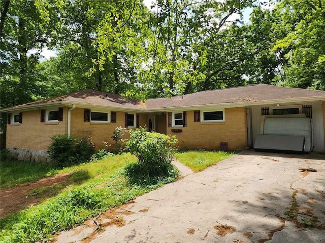 1321 Snapfinger Rd, Decatur, GA 30032 - ranch-style home featuring brick siding, an attached garage, and asphalt driveway