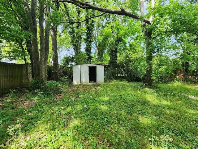 1321 Snapfinger Rd, Decatur, GA 30032 - view of yard featuring a storage shed, fence, and an outdoor structure