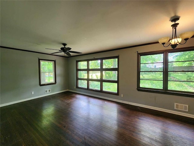 1321 Snapfinger Rd, Decatur, GA 30032 - unfurnished room with dark wood-type flooring, baseboards, crown molding, a ceiling fan, and a chandelier
