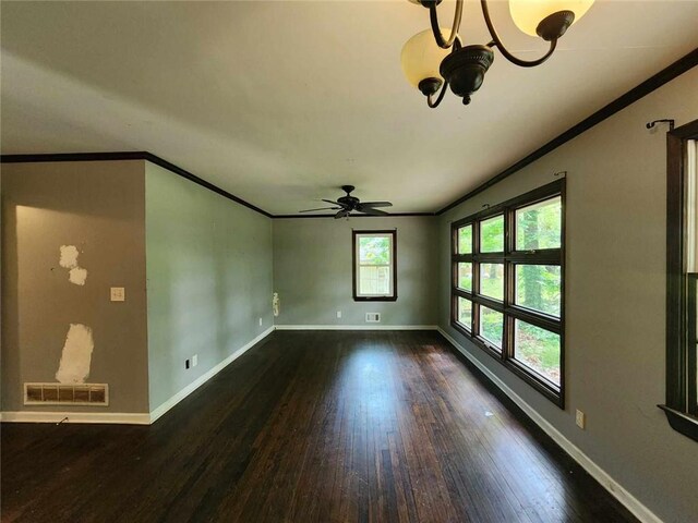 1321 Snapfinger Rd, Decatur, GA 30032 - spare room featuring ornamental molding, wood finished floors, baseboards, a ceiling fan, and a chandelier