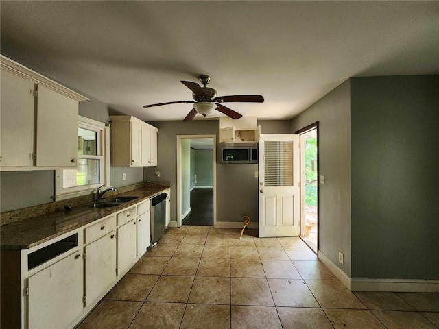 1321 Snapfinger Rd, Decatur, GA 30032 - kitchen featuring appliances with stainless steel finishes, a sink, baseboards, a ceiling fan, and light tile patterned flooring