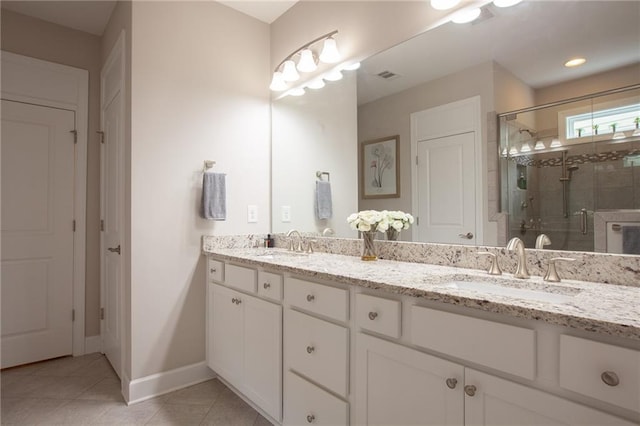 3678 Cresswind Pkwy SW, Gainesville, GA 30504 - full bath with double vanity, a stall shower, tile patterned floors, and baseboards