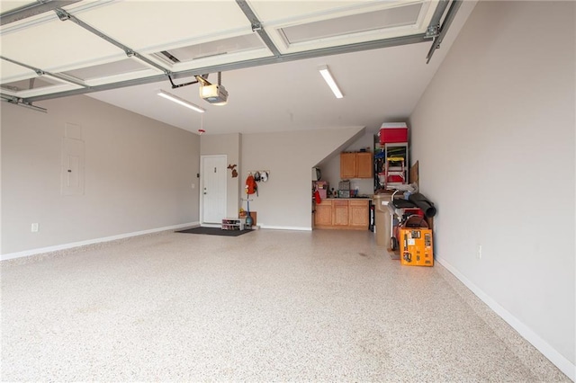 3678 Cresswind Pkwy SW, Gainesville, GA 30504 - garage featuring a garage door opener and baseboards