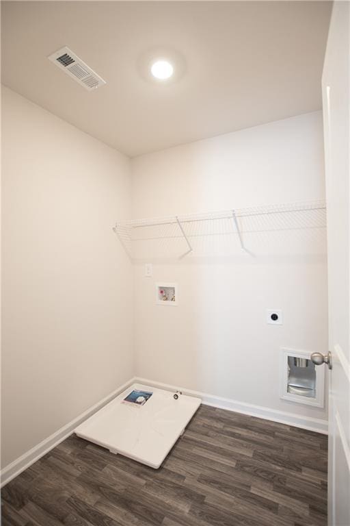 laundry room featuring dark hardwood / wood-style flooring, hookup for a washing machine, and electric dryer hookup