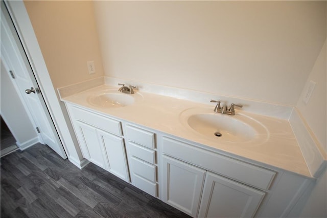 bathroom featuring vanity and hardwood / wood-style flooring