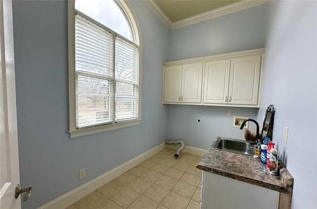 laundry area with sink, hookup for a washing machine, a healthy amount of sunlight, and crown molding