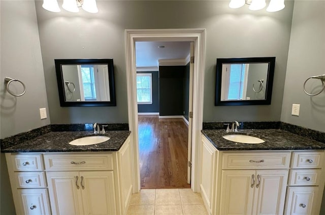 bathroom with tile patterned floors and vanity