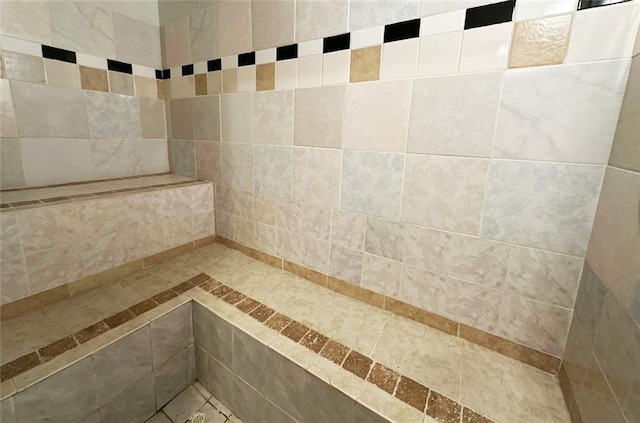 bathroom with tiled shower