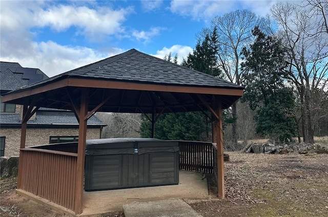 exterior space featuring a gazebo and a hot tub