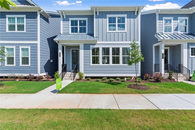 1937 Quarry Park Pl NW, Atlanta, GA 30318 - view of front of home with board and batten siding and a front yard