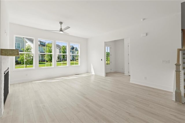 1937 Quarry Park Pl NW, Atlanta, GA 30318 - unfurnished living room featuring ceiling fan, light wood-style flooring, and baseboards