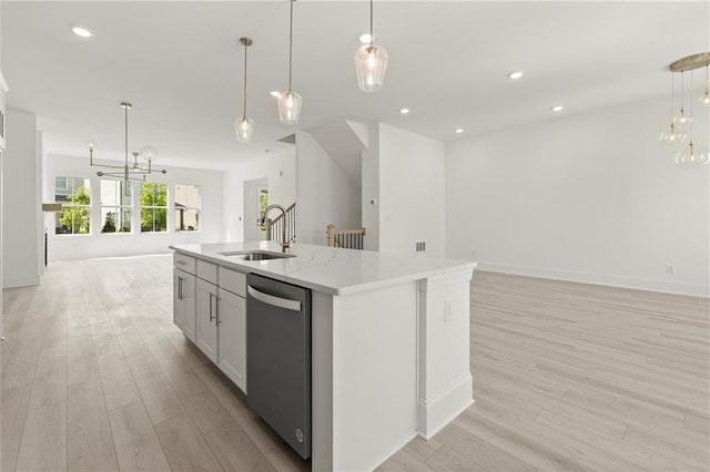 1937 Quarry Park Pl NW, Atlanta, GA 30318 - kitchen featuring open floor plan, stainless steel dishwasher, a sink, a chandelier, and light wood-style flooring
