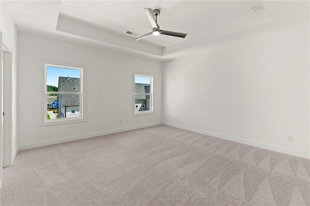 1937 Quarry Park Pl NW, Atlanta, GA 30318 - spare room with a tray ceiling, ceiling fan, healthy amount of natural light, and carpet floors