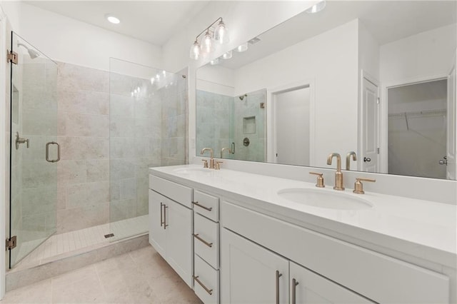 1937 Quarry Park Pl NW, Atlanta, GA 30318 - bathroom featuring a stall shower, double vanity, a walk in closet, tile patterned floors, and recessed lighting