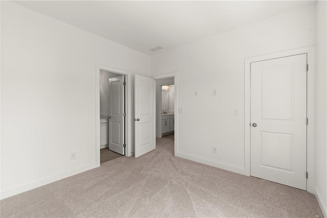 1937 Quarry Park Pl NW, Atlanta, GA 30318 - unfurnished bedroom with light carpet, baseboards, and ensuite bathroom