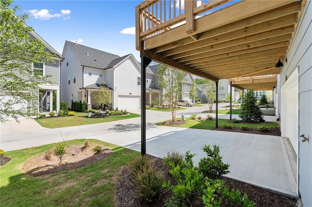 1937 Quarry Park Pl NW, Atlanta, GA 30318 - view of patio featuring a garage, a residential view, and driveway