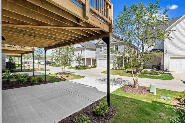 1937 Quarry Park Pl NW, Atlanta, GA 30318 - view of patio featuring an attached garage and driveway