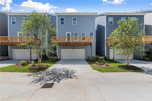 1937 Quarry Park Pl NW, Atlanta, GA 30318 - view of front of property with an attached garage, concrete driveway, and a balcony