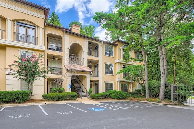 3777 Peachtree Rd NE Unit 438, Brookhaven, GA 30319 - view of property with uncovered parking and stairway