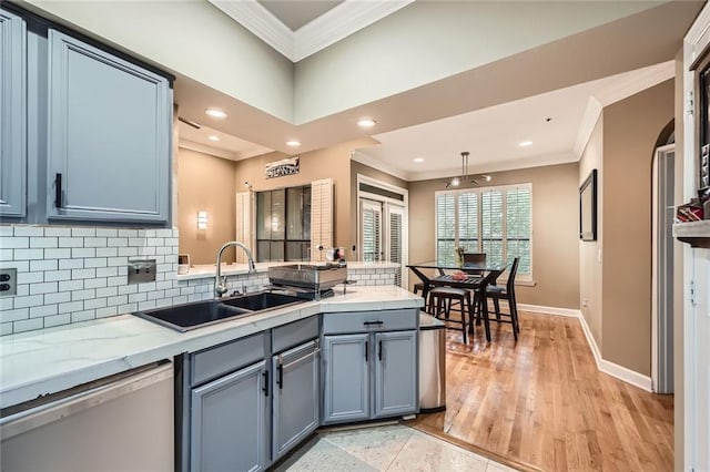 3777 Peachtree Rd NE Unit 438, Brookhaven, GA 30319 - kitchen featuring dishwasher, crown molding, a peninsula, tasteful backsplash, and recessed lighting