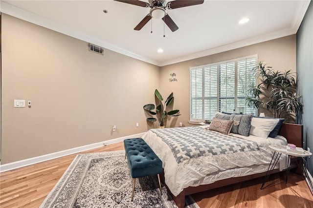 3777 Peachtree Rd NE Unit 438, Brookhaven, GA 30319 - bedroom with light wood-type flooring, crown molding, recessed lighting, and a ceiling fan