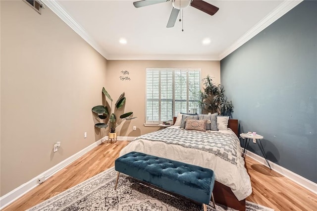 3777 Peachtree Rd NE Unit 438, Brookhaven, GA 30319 - bedroom with wood finished floors, ornamental molding, ceiling fan, and recessed lighting