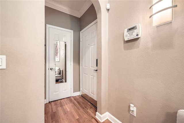 3777 Peachtree Rd NE Unit 438, Brookhaven, GA 30319 - corridor with crown molding, arched walkways, and wood finished floors