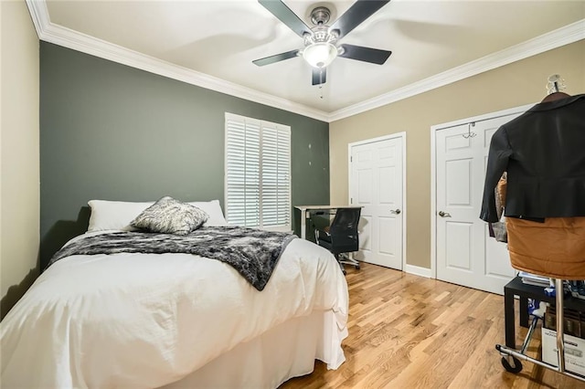 3777 Peachtree Rd NE Unit 438, Brookhaven, GA 30319 - bedroom featuring crown molding, light wood-style flooring, and ceiling fan