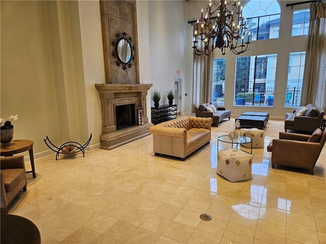 3777 Peachtree Rd NE Unit 438, Brookhaven, GA 30319 - living room featuring a chandelier, healthy amount of natural light, a towering ceiling, and a premium fireplace