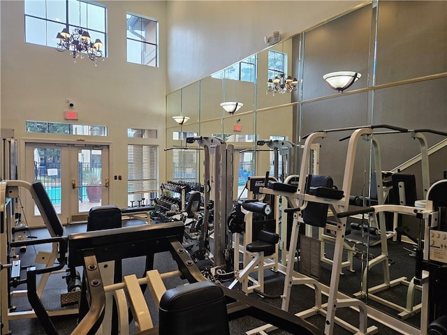 3777 Peachtree Rd NE Unit 438, Brookhaven, GA 30319 - exercise room featuring a chandelier, a high ceiling, and french doors