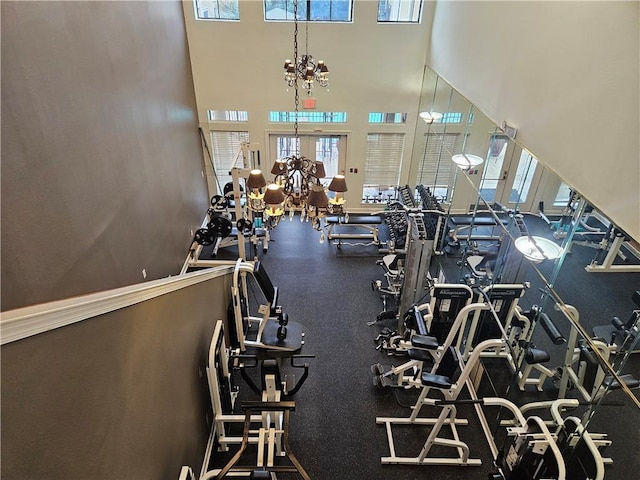 3777 Peachtree Rd NE Unit 438, Brookhaven, GA 30319 - workout area featuring healthy amount of natural light, a towering ceiling, and a chandelier