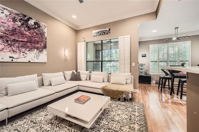 3777 Peachtree Rd NE Unit 438, Brookhaven, GA 30319 - living room featuring a ceiling fan, crown molding, light wood-style floors, and recessed lighting
