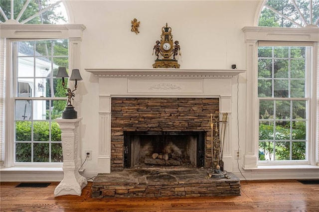 2355 Quail Creek Ter, Buford, GA 30519 - detailed view of wood finished floors and a stone fireplace