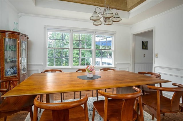 2355 Quail Creek Ter, Buford, GA 30519 - dining space with a chandelier, crown molding, a decorative wall, a wainscoted wall, and a tray ceiling