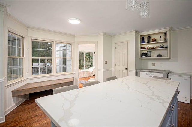 2355 Quail Creek Ter, Buford, GA 30519 - kitchen featuring dark wood finished floors, open shelves, light stone counters, crown molding, and a chandelier
