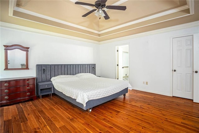2355 Quail Creek Ter, Buford, GA 30519 - bedroom featuring a raised ceiling, dark wood-style floors, crown molding, ceiling fan, and ensuite bathroom