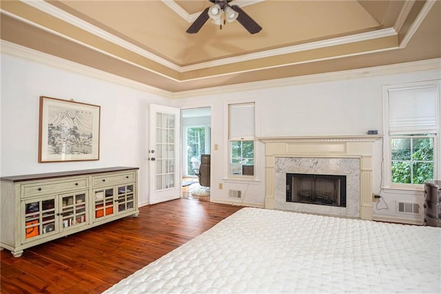 2355 Quail Creek Ter, Buford, GA 30519 - bedroom with a tray ceiling, wood finished floors, multiple windows, and crown molding