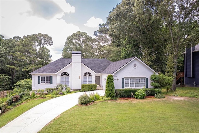 2355 Quail Creek Ter, Buford, GA 30519 - single story home with a front lawn, a chimney, and driveway