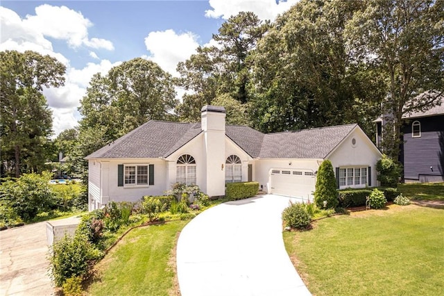 2355 Quail Creek Ter, Buford, GA 30519 - ranch-style home with a chimney, driveway, a front yard, an attached garage, and stucco siding