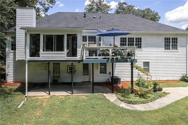 2355 Quail Creek Ter, Buford, GA 30519 - rear view of property featuring a sunroom, a chimney, a patio, a yard, and a wooden deck