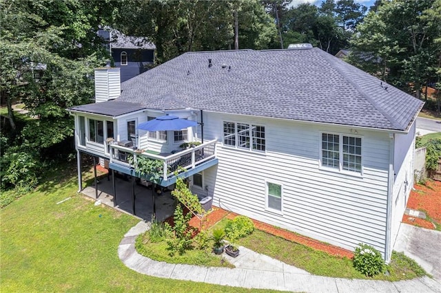 2355 Quail Creek Ter, Buford, GA 30519 - rear view of house featuring a chimney, a lawn, a wooden deck, and a shingled roof