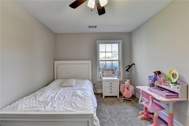 carpeted bedroom with visible vents, baseboards, and a ceiling fan