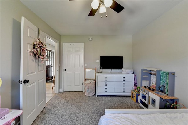carpeted bedroom featuring ceiling fan