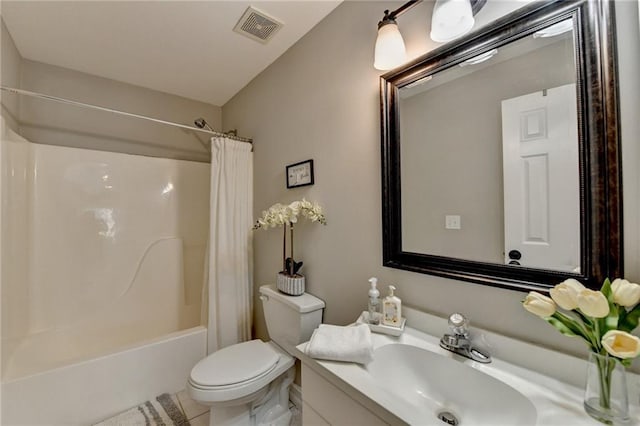 bathroom featuring vanity, shower / bath combo, tile patterned floors, toilet, and visible vents