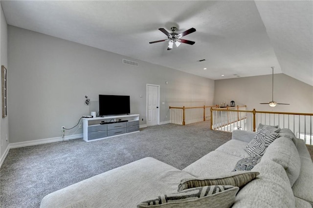 living area with visible vents, baseboards, a ceiling fan, and carpet