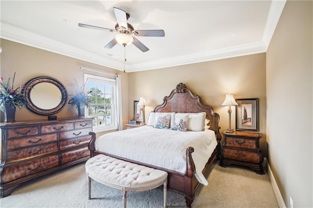 bedroom with ornamental molding, baseboards, ceiling fan, and carpet floors