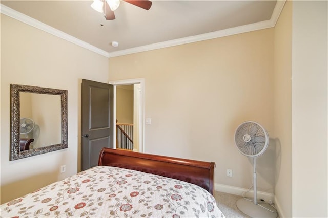 bedroom with a ceiling fan, carpet flooring, baseboards, and ornamental molding